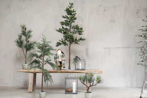 Artificial spruce trees from Speedtsberg by a stream with lanterns and a Santa figure