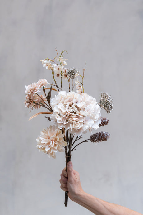Bouquet of artificial pink flowers and glittered pinecone branches from Speedtsberg