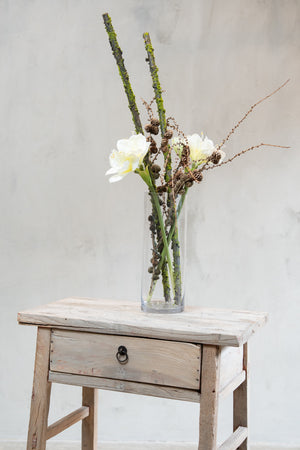 Vase with pine cone branches, moss-covered branches and artificial white amaryllis flowers from Speedtsberg