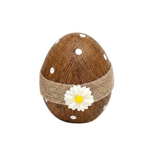 Easter egg with thread and flower