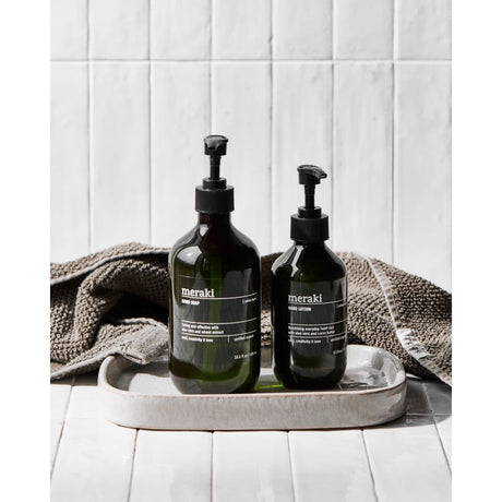 Green pump bottles from Meraki with Cotton Haze scent