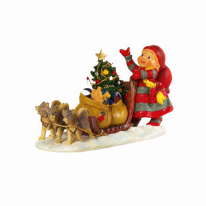 Baby elf with sled dogs