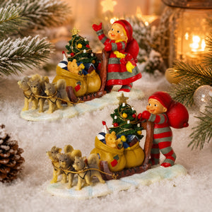 Baby elf with sled dogs
