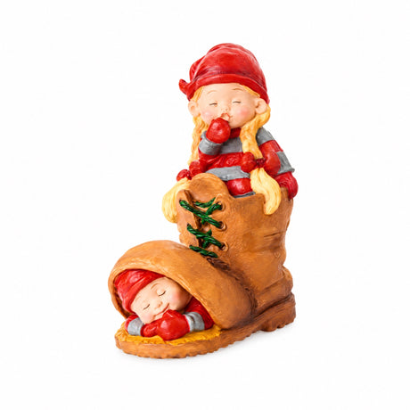 Baby elf sleeping in shoes / mittens