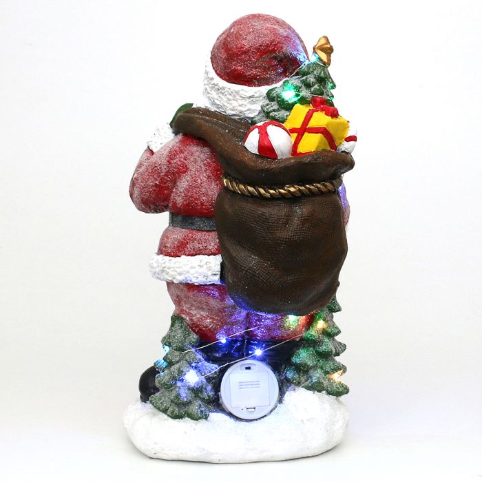 Lyskæden slynger sig om julemandens støvler og gavesæk – små detaljer