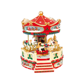 Julekarrusel i flotte julefarver med heste, der drejer rundt og forskellige julemelodier fra Musicboxworld.