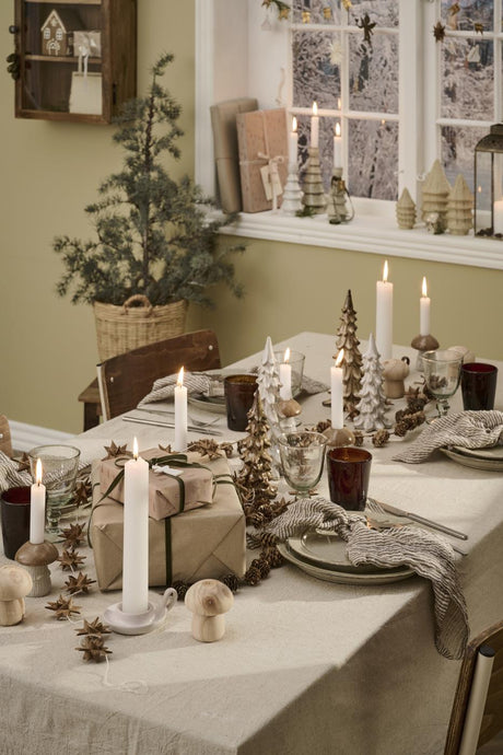 Rectangular linen-colored cotton tablecloth from Ib Laursen with a Christmas table setting