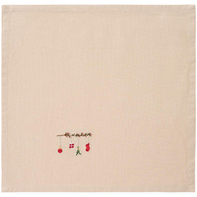 Linen-colored cloth napkin with Tradition branch hanging Christmas ornament from Ib Laursen