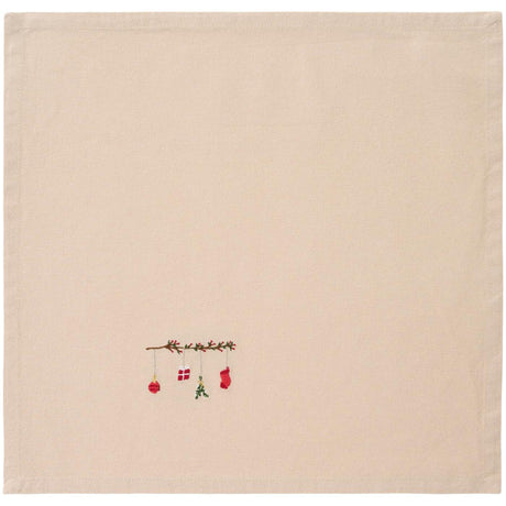 Linen-colored cloth napkin with Tradition branch hanging Christmas ornament from Ib Laursen