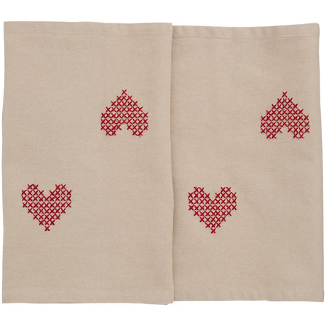 Tradition table runner with red cross-stitched hearts from Ib Laursen