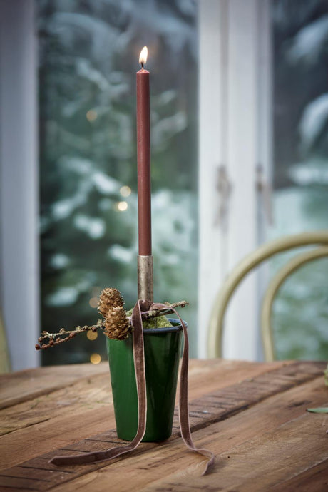 Brown candle from Ib Laursen in a Christmas decoration on a table