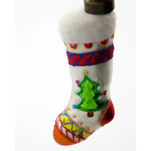 Close-up of a glass Christmas ornament shaped like a small Christmas stocking from House Doctor