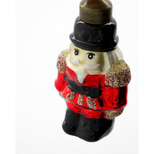 Close-up of a glass Christmas bauble shaped like a Nutcracker soldier from House Doctor