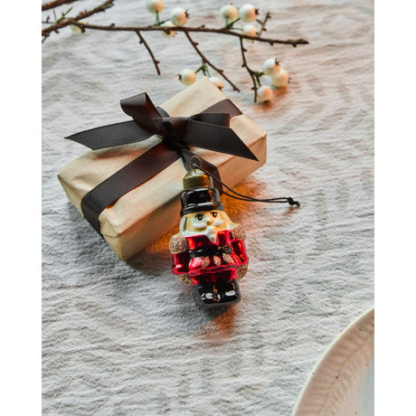 Christmas bauble shaped like a Nutcracker soldier from House Doctor, used as gift decoration