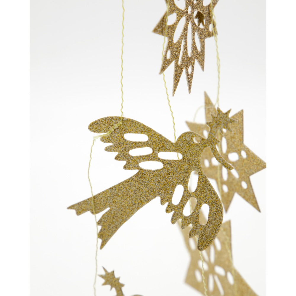 Close-up of gold-glitter figures on a garland from House Doctor
