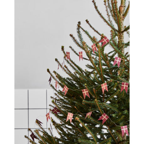 Christmas tree decorated with flag garland from House Doctor