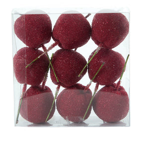 Red candy apples on wooden sticks for decoration