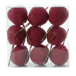 Red candy apples on wooden sticks for decoration