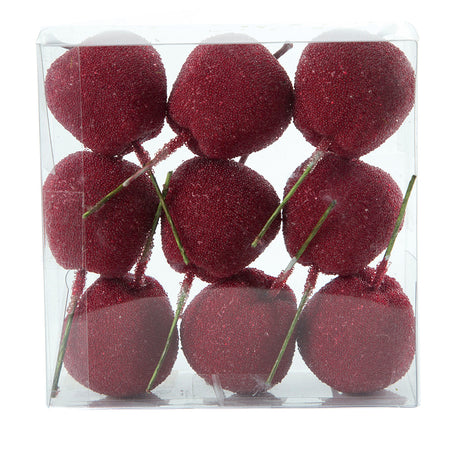 Red candy apples on wooden sticks for decoration