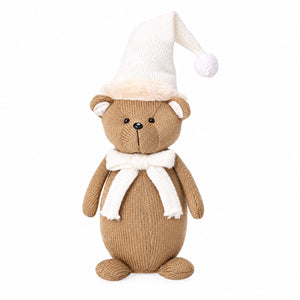 Standing winter bear with brown knitted fur and a white hat