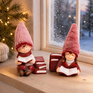 Winter children reading in the snow