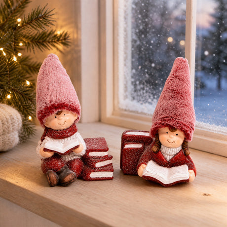 Winter children reading in the snow