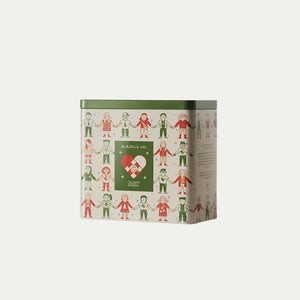 Cookie tin with the Christmas Seal 2026 featuring colorful children, a red Christmas heart, and a green lid