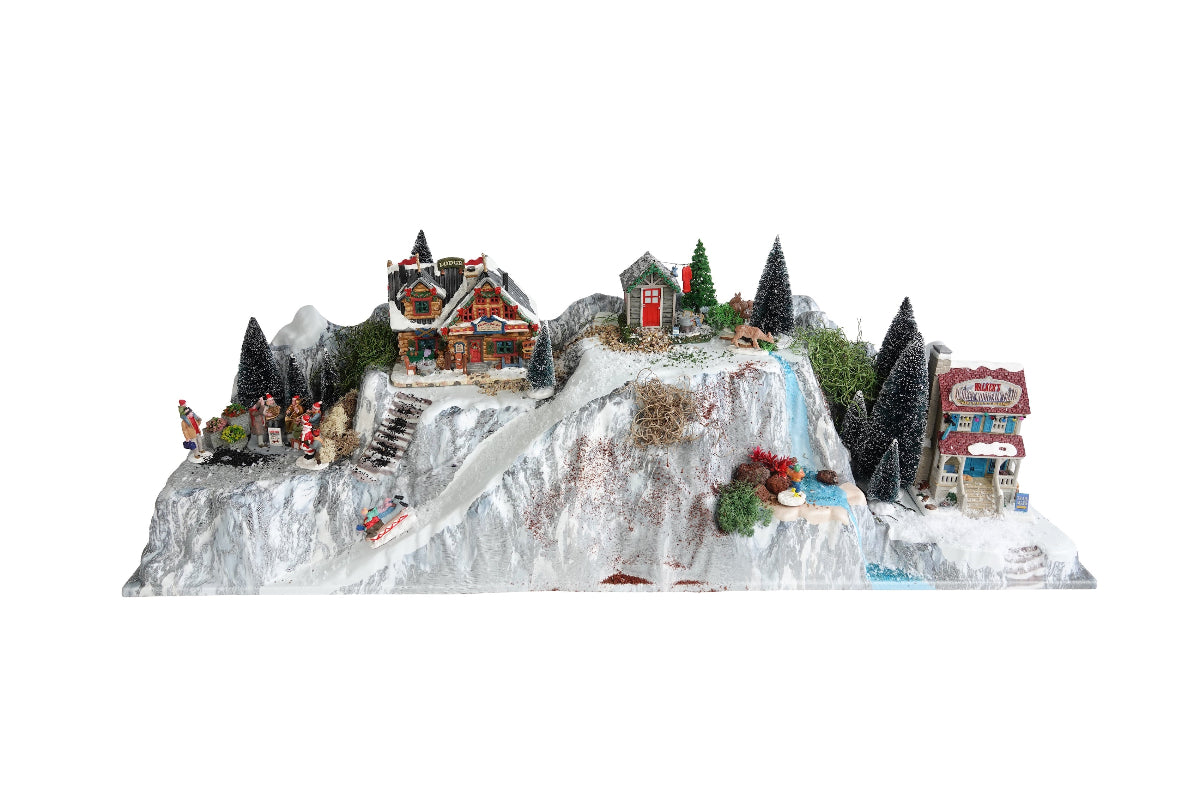 Bjergfundament med vandfald bebygget med Lemax huse og tilbehør