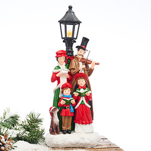 Christmas carolers at a lamppost with LED lights from Pobra