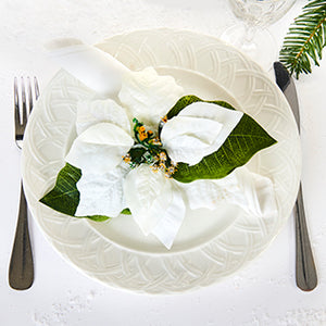 Napkin ring with white poinsettia for the Christmas table