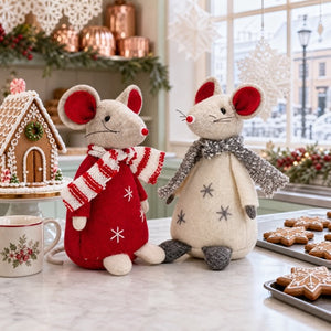 The Christmas mice have hopped up onto the kitchen table to get the cookies.