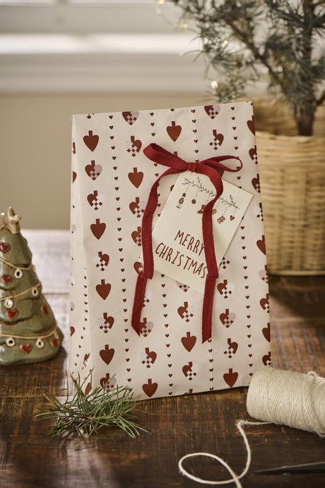 Large flat-bottom bags with woven hearts and red ribbon