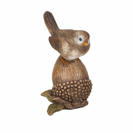 Bird sitting on pine cone/acorn