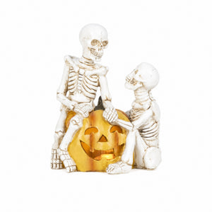 Skeletons with pumpkins and LED lights