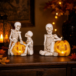 Skeletons with pumpkins and LED lights