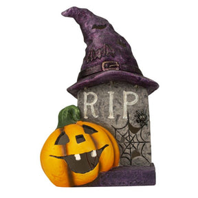 Gravsten med hat og græskar