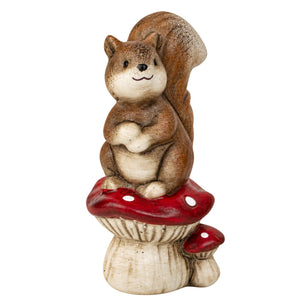 Squirrel standing on mushroom