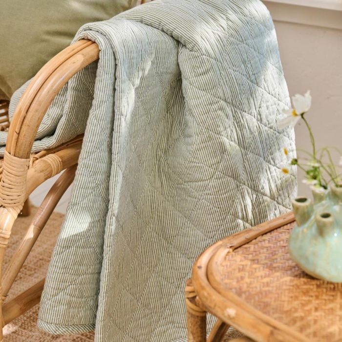 Quilt with white and dusty green milk boy stripes